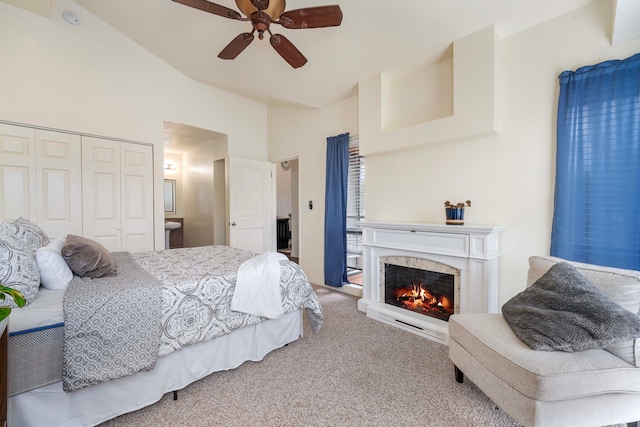 carpeted bedroom with a closet and ceiling fan