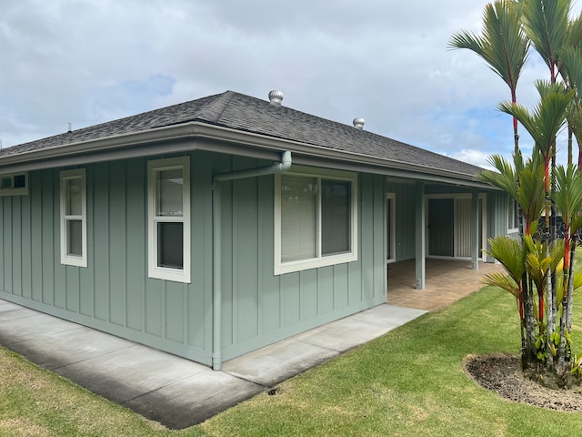 view of home's exterior with a yard