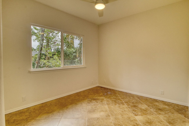 spare room with ceiling fan