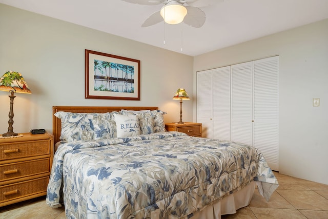 tiled bedroom featuring a closet and ceiling fan