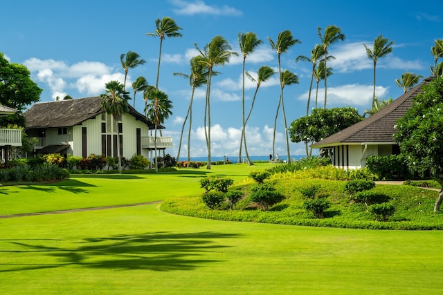 surrounding community featuring a lawn