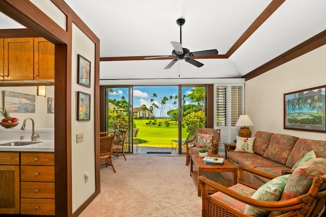 carpeted living room with lofted ceiling, ceiling fan, and sink