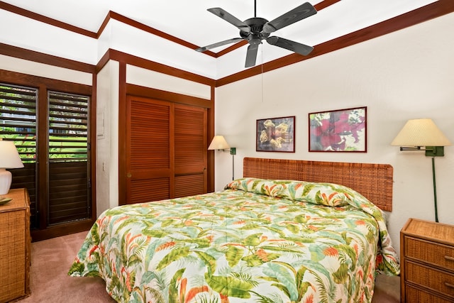 bedroom with a closet, ceiling fan, and carpet floors