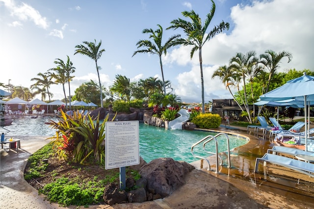 view of pool featuring a water slide