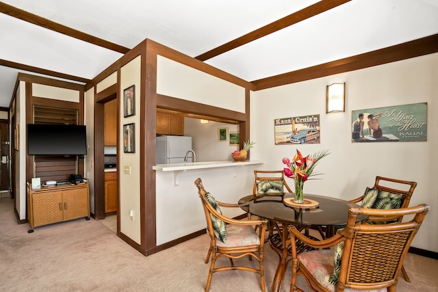 carpeted dining area featuring sink