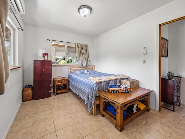 bedroom featuring light tile patterned flooring and a wall mounted AC