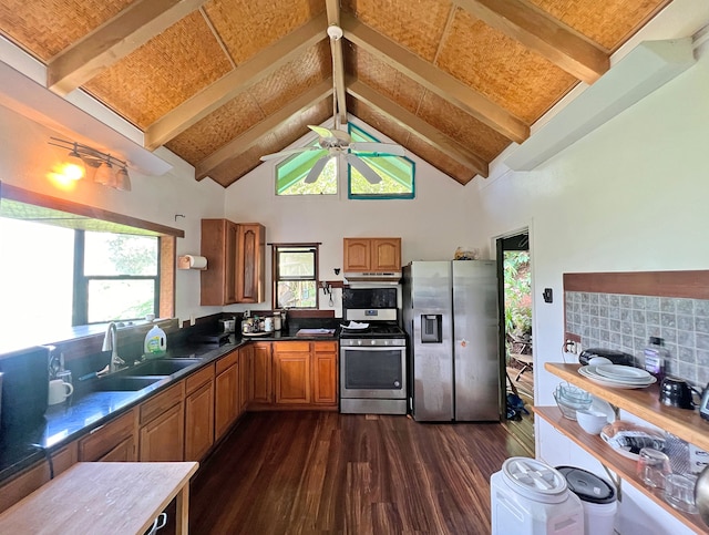 kitchen featuring appliances with stainless steel finishes, sink, beamed ceiling, and dark hardwood / wood-style flooring