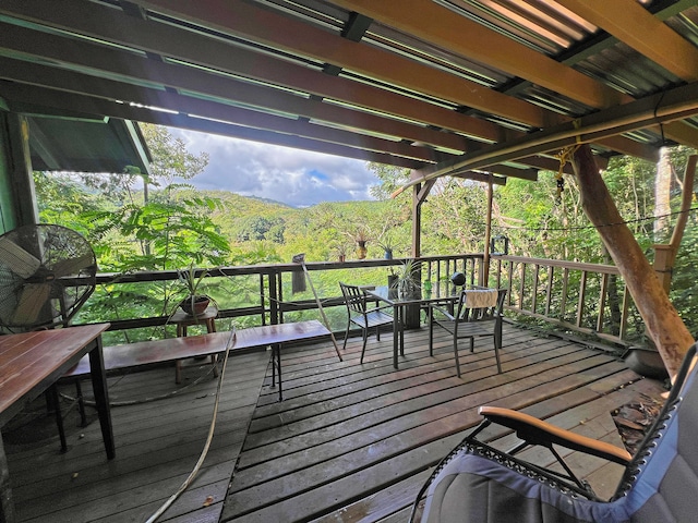 wooden terrace featuring a mountain view