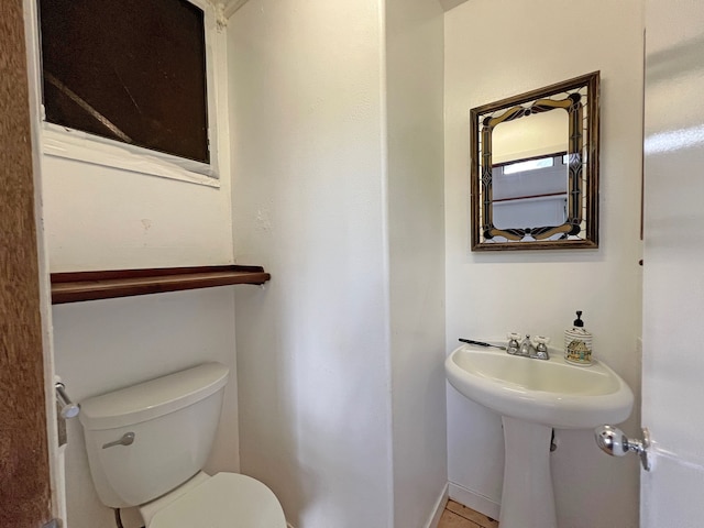 bathroom featuring toilet