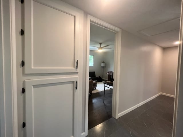 corridor with dark wood-type flooring