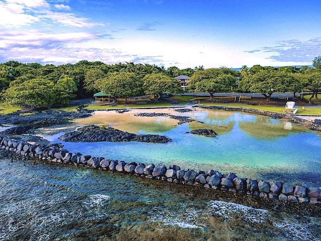 view of community with a water view