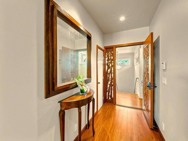 corridor featuring hardwood / wood-style floors