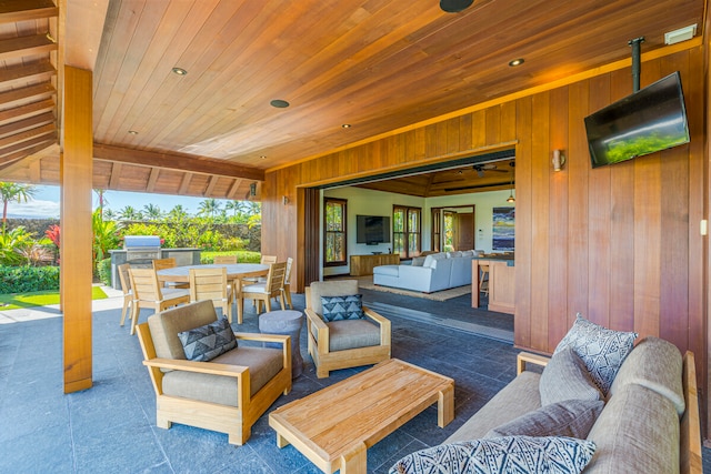 view of patio / terrace with area for grilling, ceiling fan, and an outdoor hangout area