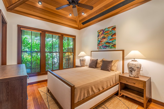 bedroom with wood ceiling, ceiling fan, and hardwood / wood-style floors