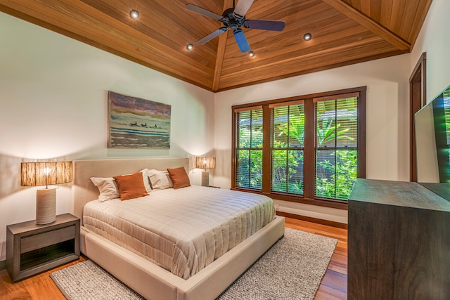 bedroom featuring high vaulted ceiling, hardwood / wood-style flooring, wooden ceiling, and ceiling fan