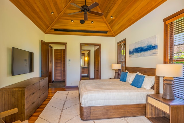 bedroom with wooden ceiling, hardwood / wood-style floors, ceiling fan, and high vaulted ceiling