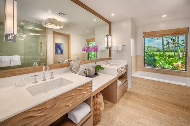 bathroom with vanity, plus walk in shower, and tile patterned flooring