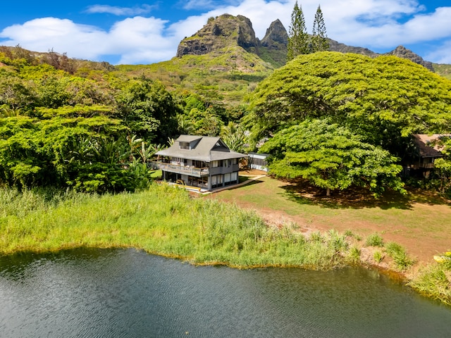 aerial view featuring a water and mountain view