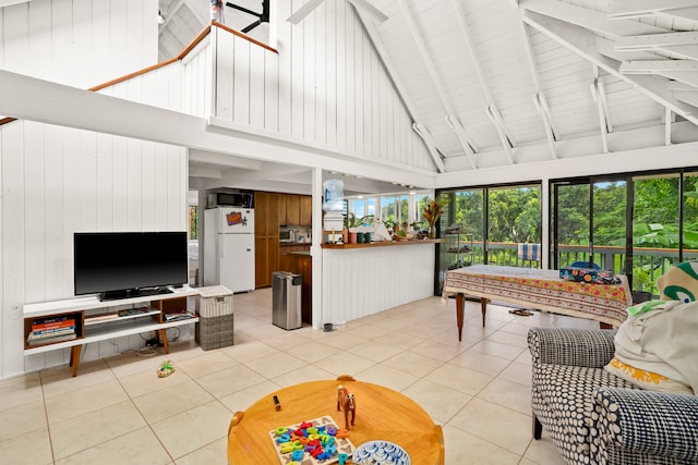 sunroom / solarium with lofted ceiling with beams and ceiling fan