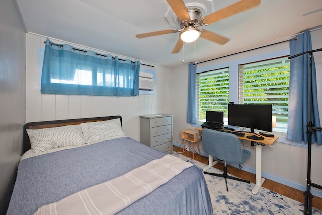 bedroom featuring ceiling fan and hardwood / wood-style floors