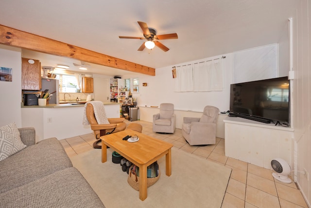 living room with beam ceiling, sink, ceiling fan, and light tile patterned floors