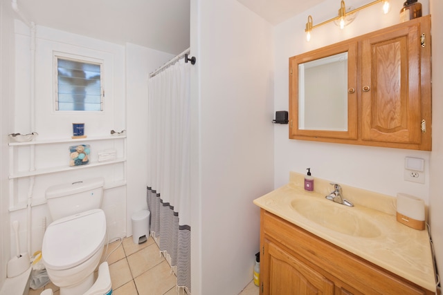 bathroom with vanity, toilet, walk in shower, and tile patterned flooring