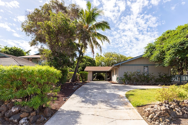 view of front of home featuring a carport