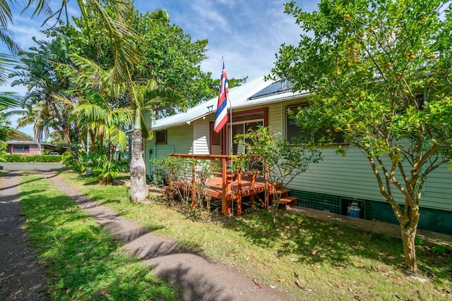 view of home's exterior with a wooden deck