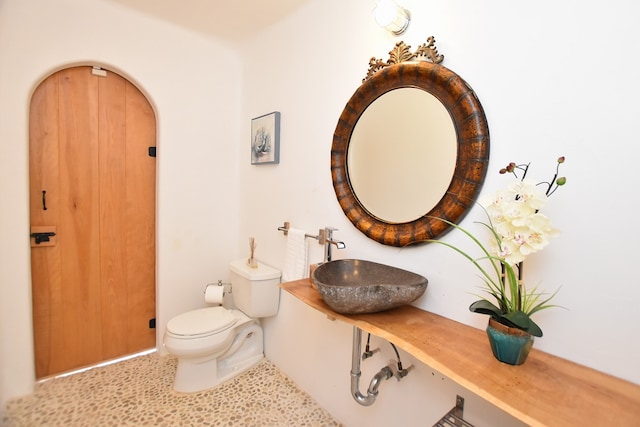 bathroom with sink and toilet