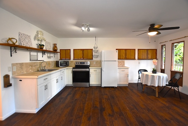 kitchen featuring white cabinetry, sink, dark hardwood / wood-style floors, and appliances with stainless steel finishes