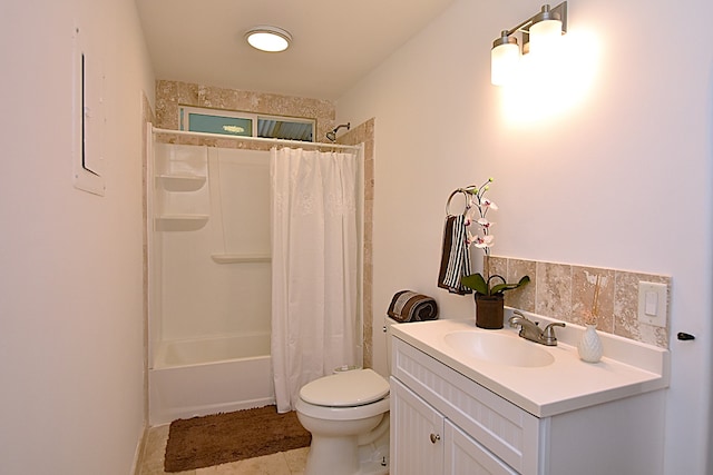 full bathroom featuring tile patterned flooring, vanity, toilet, and shower / bathtub combination with curtain