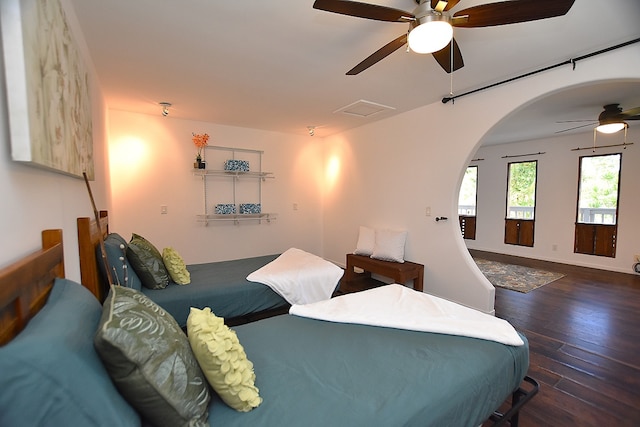 bedroom featuring ceiling fan and dark hardwood / wood-style floors