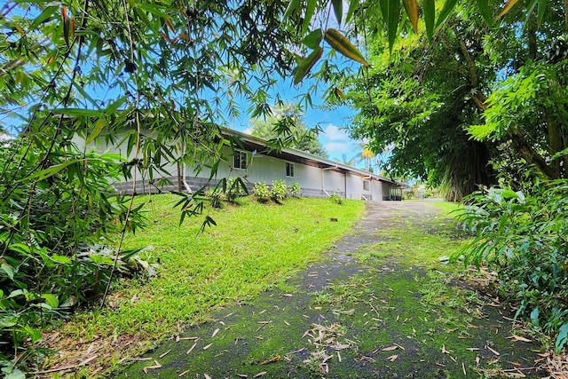 view of home's exterior featuring a yard