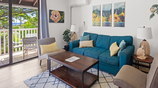 living room with light hardwood / wood-style flooring and a wall mounted AC