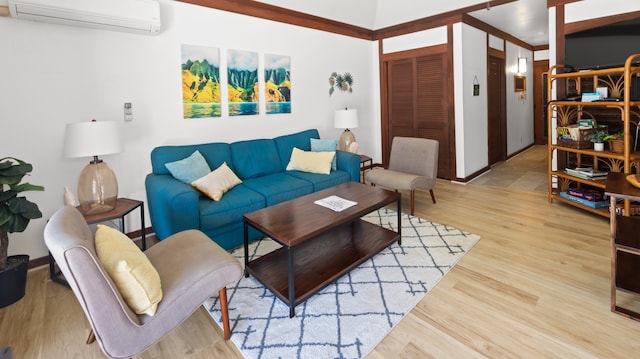 living room with light wood-type flooring and an AC wall unit