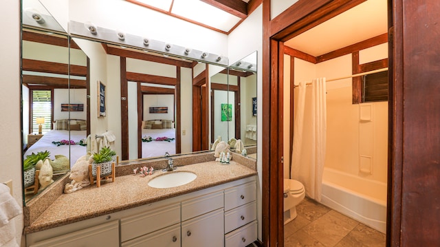 full bathroom featuring vanity, shower / tub combo, and toilet