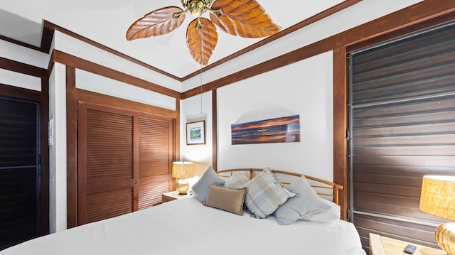 bedroom with a closet and crown molding