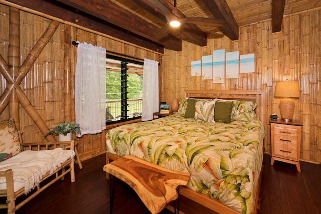 bedroom featuring access to outside, beamed ceiling, wooden walls, and dark hardwood / wood-style floors