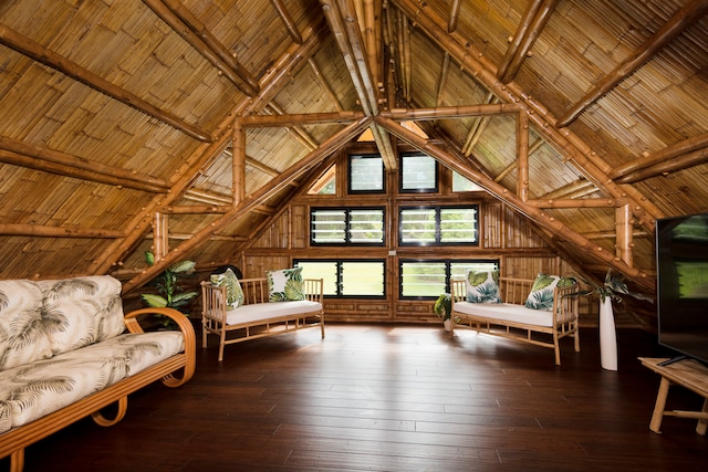 living area featuring wooden walls, hardwood / wood-style floors, high vaulted ceiling, and wooden ceiling