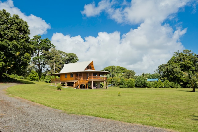 view of home's community featuring a yard