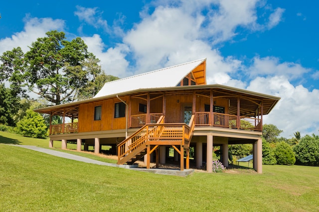 rear view of house with a lawn