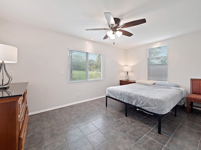 tiled bedroom with ceiling fan