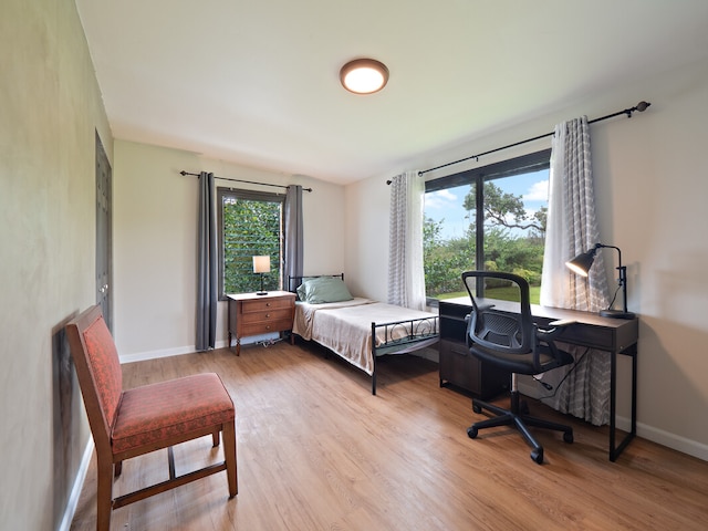 bedroom with light hardwood / wood-style flooring