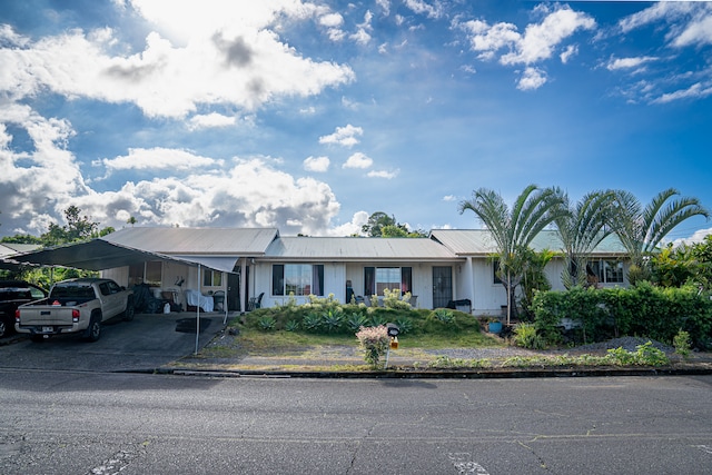 ranch-style home with a carport