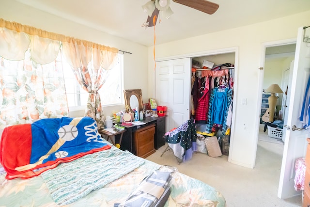 carpeted bedroom featuring a closet and ceiling fan