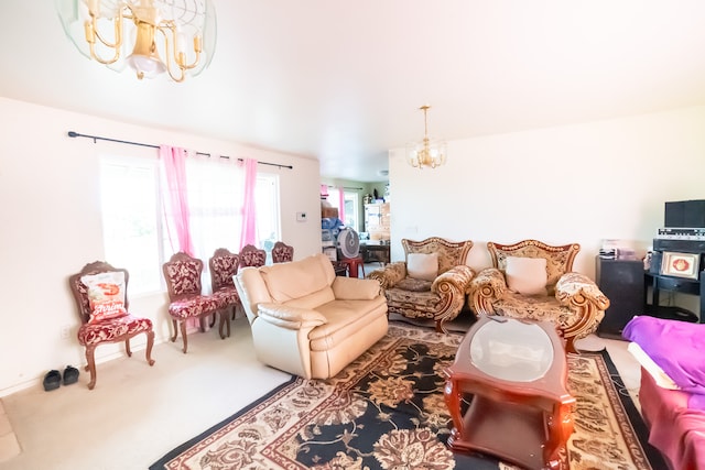 carpeted living room featuring an inviting chandelier