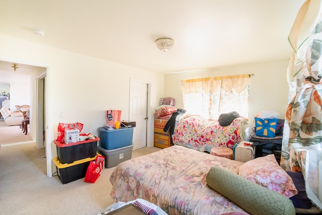 bedroom featuring light carpet