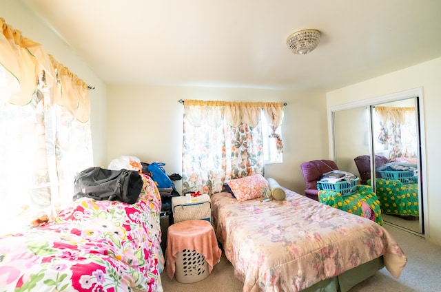 bedroom featuring a closet and carpet flooring