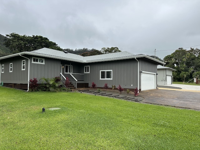 view of front facade with a garage and a front yard