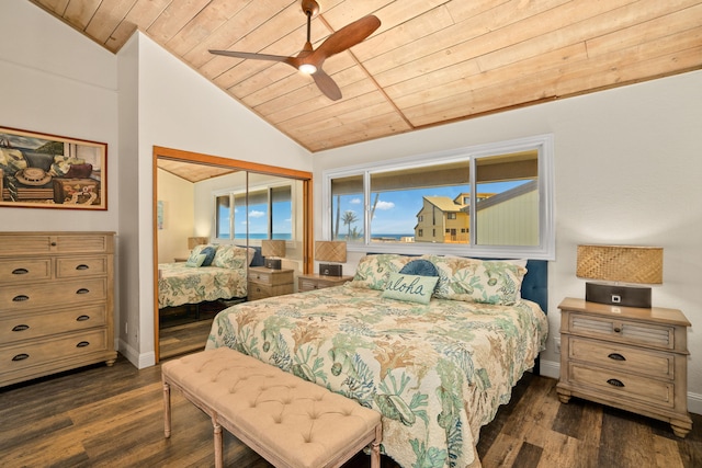 bedroom featuring lofted ceiling, ceiling fan, a closet, dark wood-type flooring, and wooden ceiling